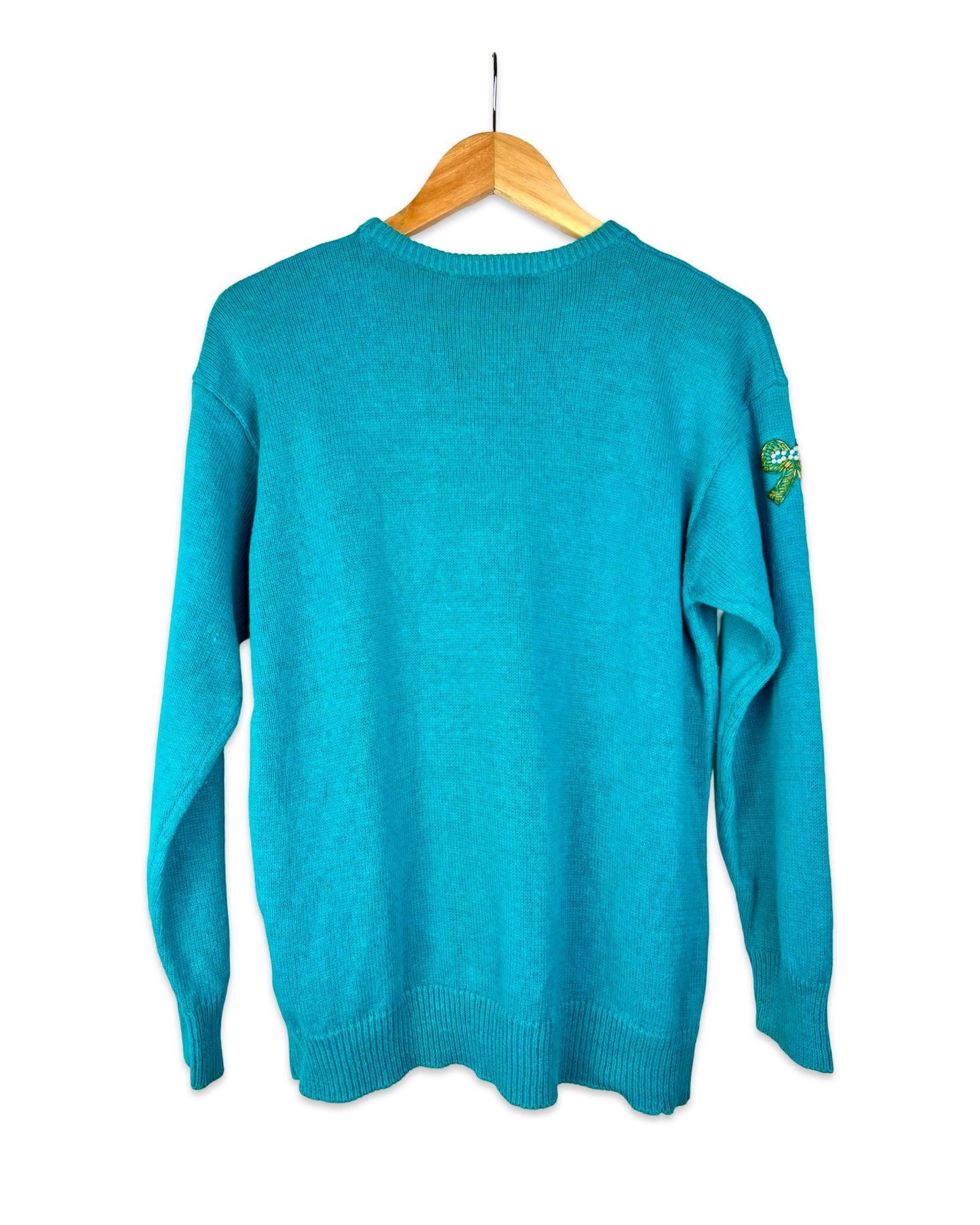 Turquoise trui met strikjes - L